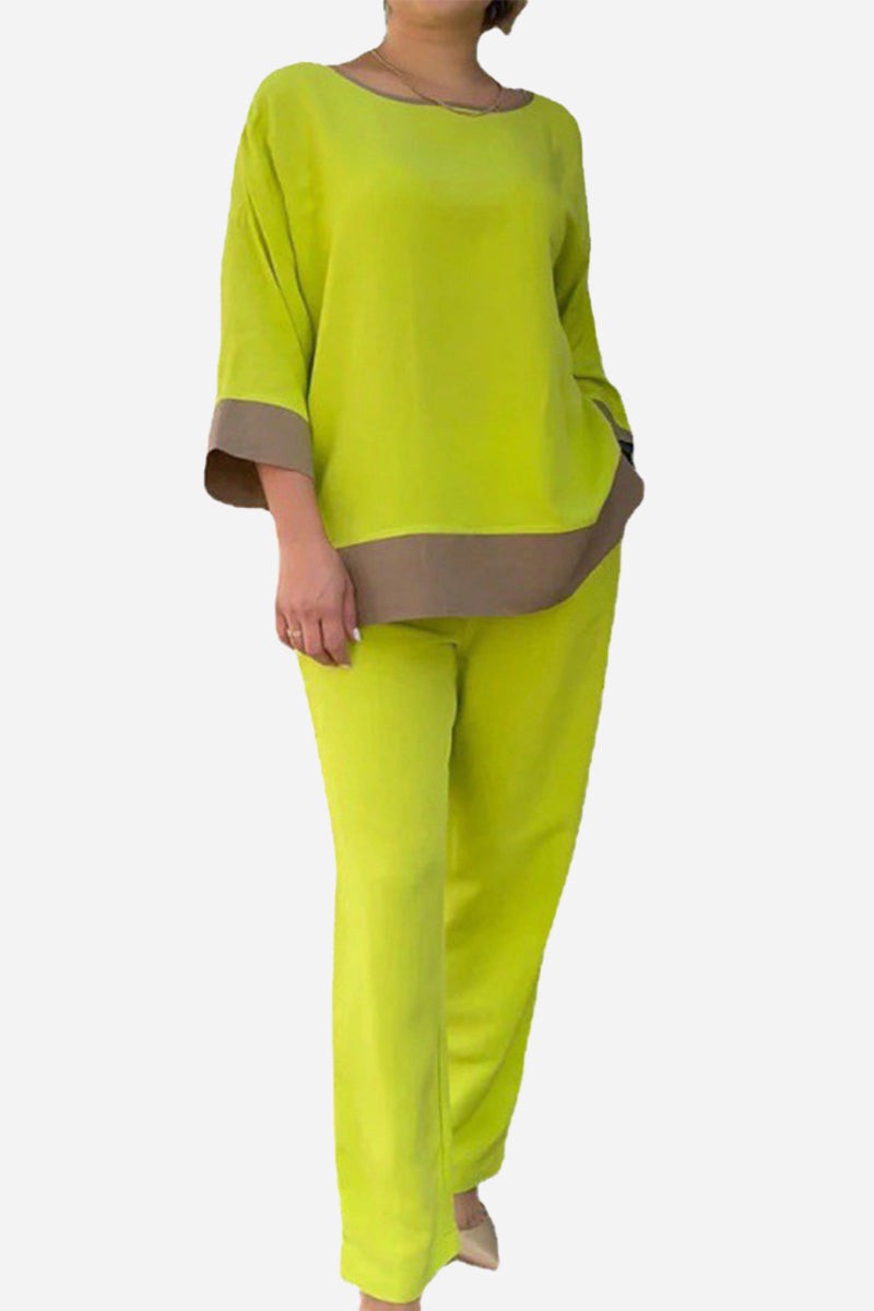 Woman wearing lime green dual-tone 3/4 sleeve two-piece set with brown trim, relaxed fit cotton blend outfit for changing seasons