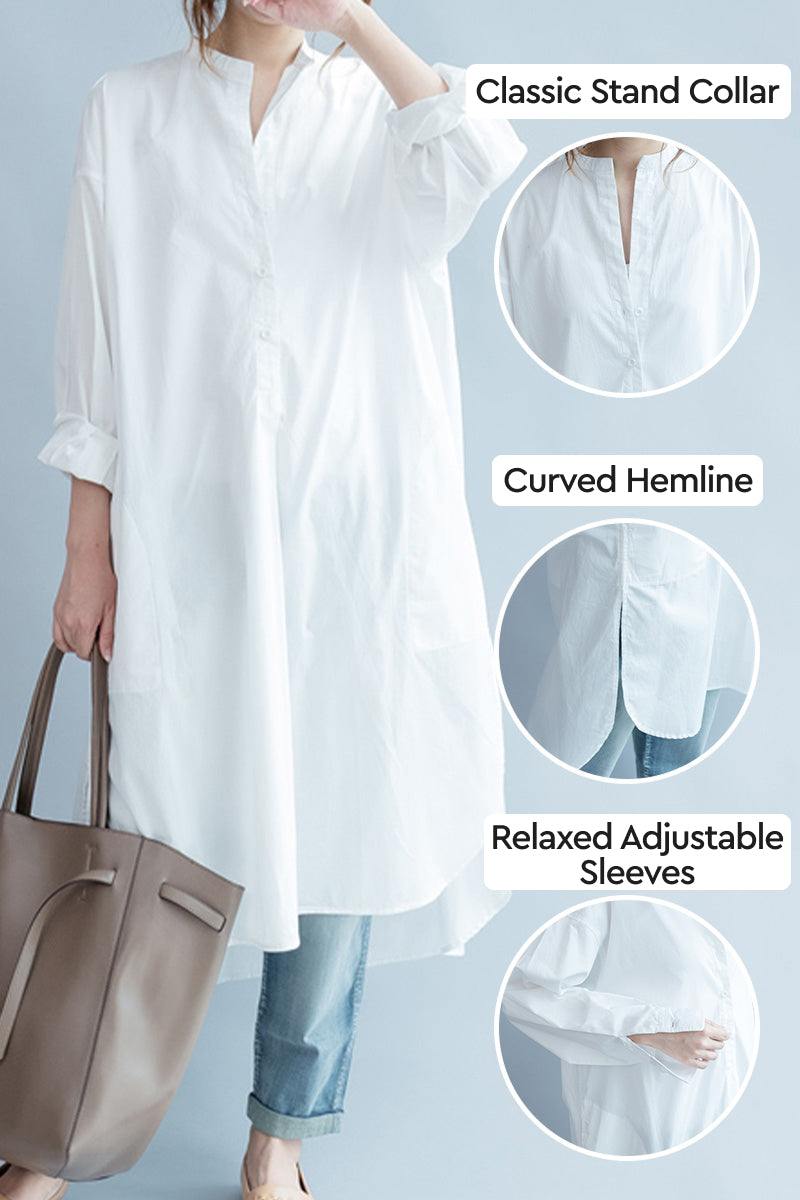 White pure cotton long shirt with classic stand collar, curved hemline, and relaxed adjustable sleeves, styled oversized for casual elegance.
