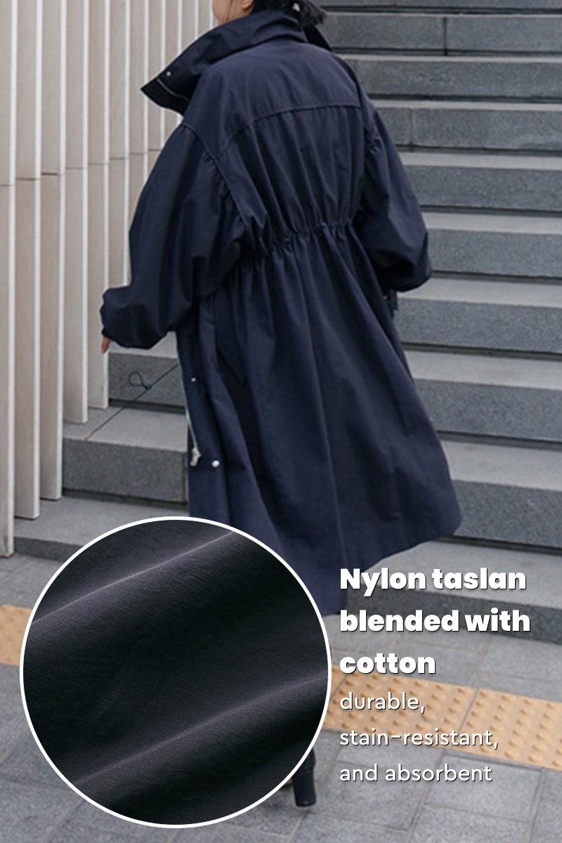 Back view of oversized cotton stain-resistant coat in navy, made from durable nylon taslan and cotton blend fabric.