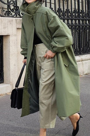 Oversized green cotton blend stain-resistant travel coat with button-front and lightweight design