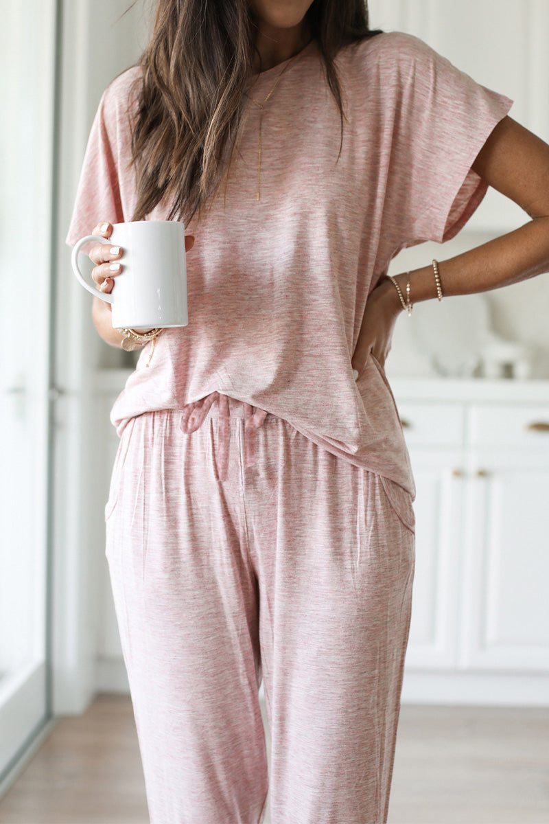 woman wearing pink ultra-soft two-piece loungewear set holding white mug indoors