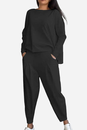 Woman wearing black All-Day Comfort 2-Piece Outfit Set with long sleeves and loose pants, styled for casual comfort.