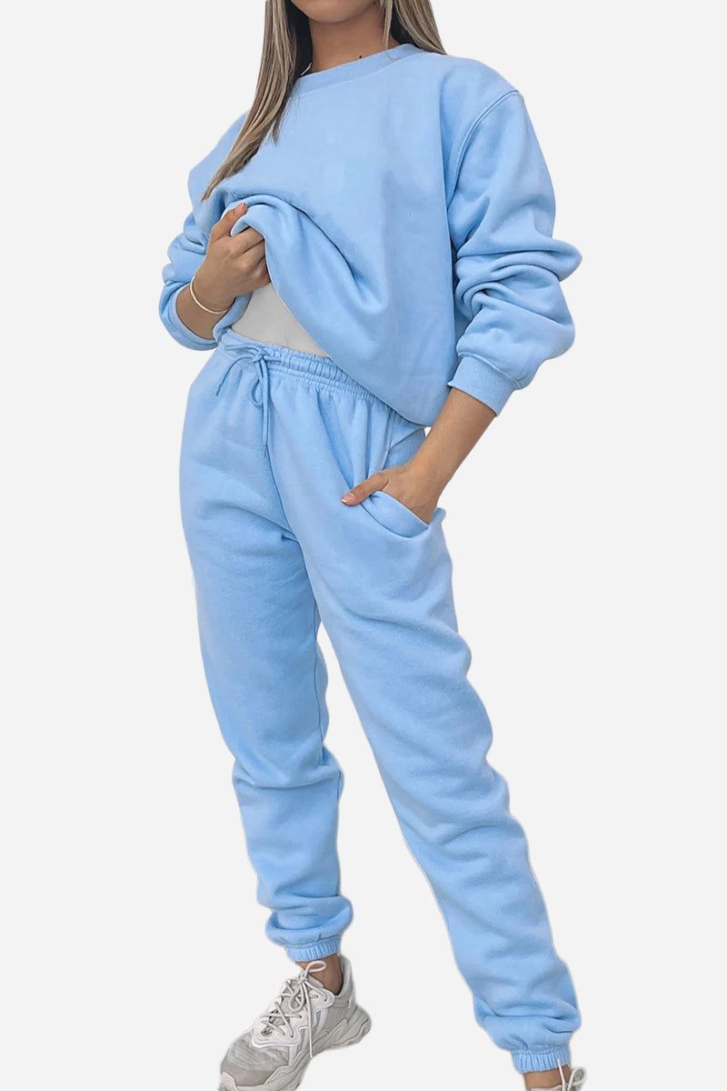 Woman wearing light blue Classic Comfort Athleisure set with sweatshirt and jogger pants