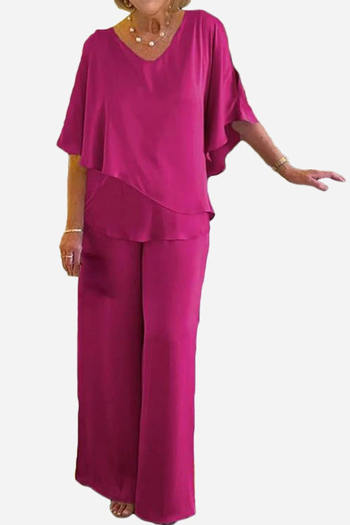 Elegant Layers Two-Piece Set in vibrant magenta with layered V-neck top and wide-leg pants.
