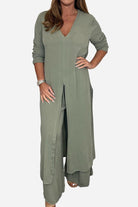 Woman wearing sage green Urban Chic V-Neck Split Top and matching wide-leg pants two-piece set