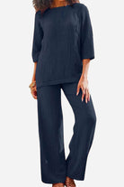 woman wearing navy textured two-piece set with loose fit and three-quarter sleeves