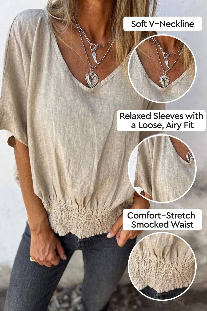 Light beige pure linen short-sleeve blouse with V-neckline, relaxed sleeves, and smocked waist detail