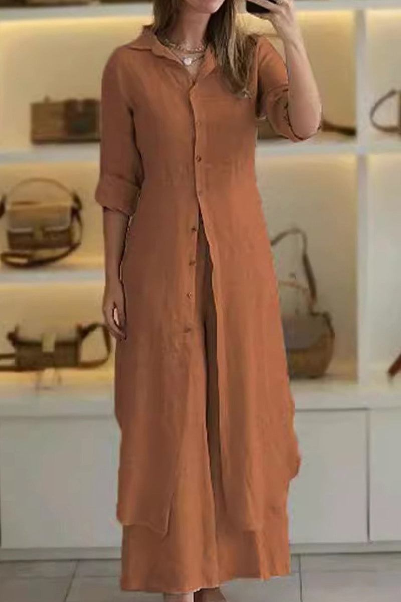 Woman wearing rust-colored refined comfort coordinated wide-leg two-piece outfit with long button-up top and matching pants