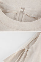 Close-up of breathable cotton-linen fabric texture and button loop detail on beige two-piece set