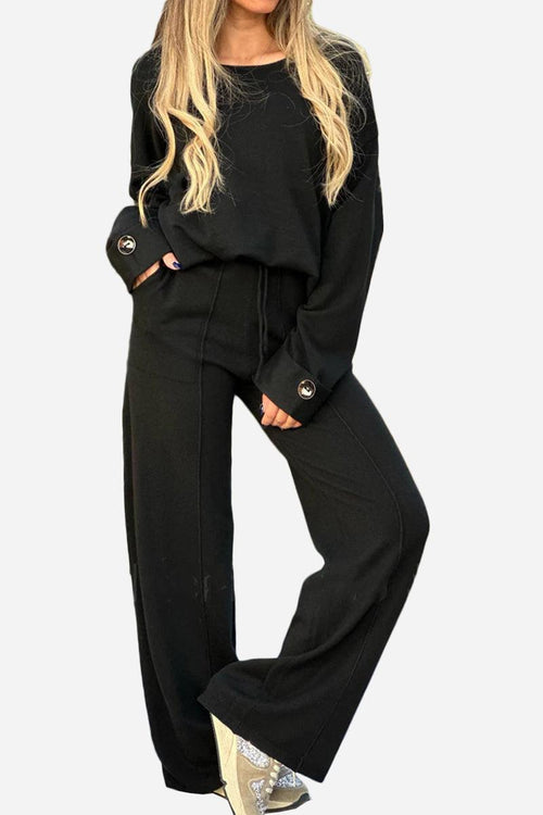 black comfortable travel-ready two-piece set with wide-leg pants and button-cuff sweater