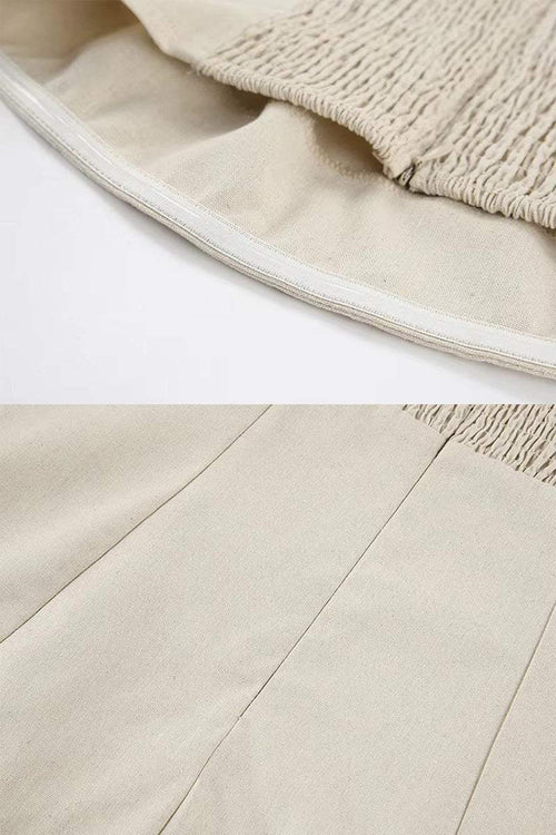 Close-up of breathable beige cotton linen blend fabric and elastic back panel of strapless dress