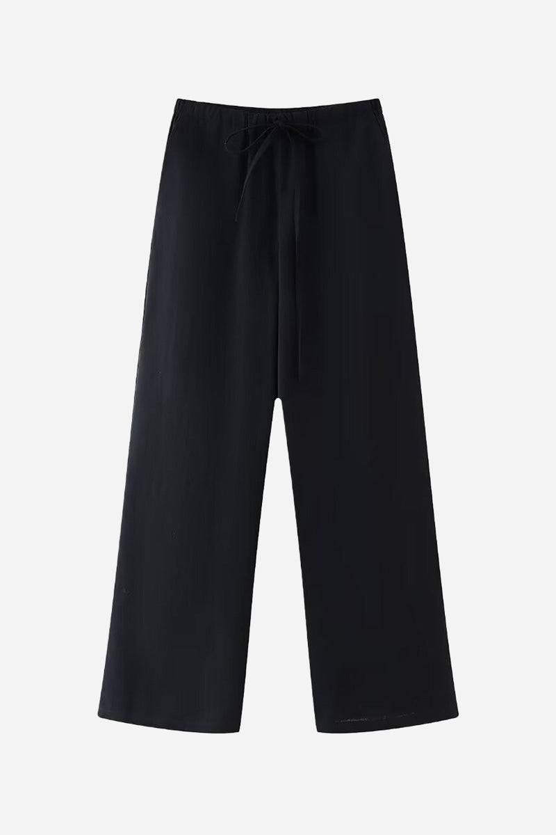 Black wide-leg pants from Mix-Match Lounge-to-Travel Set with a relaxed fit and drawstring waist.