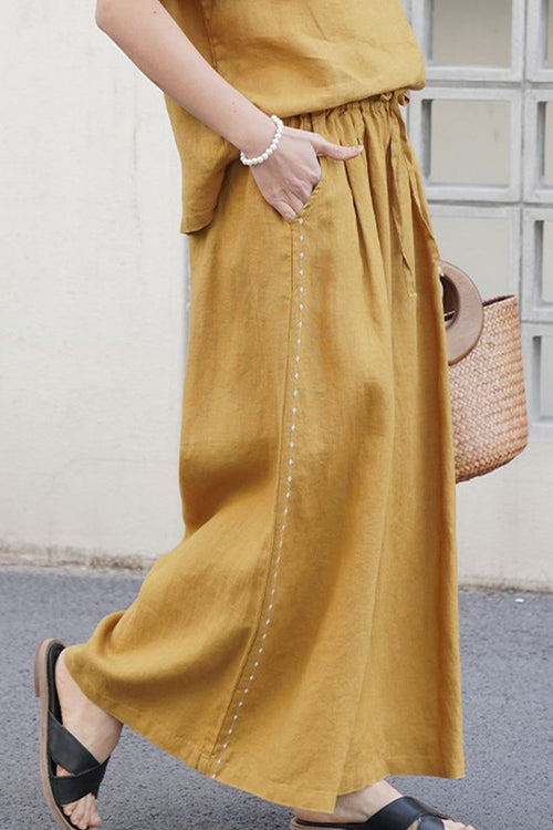100% linen wide-leg pants with elastic waist in mustard color, breathable and comfortable fit for everyday wear