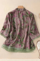 French boutique style organza blouse with floral print and green sheer trim