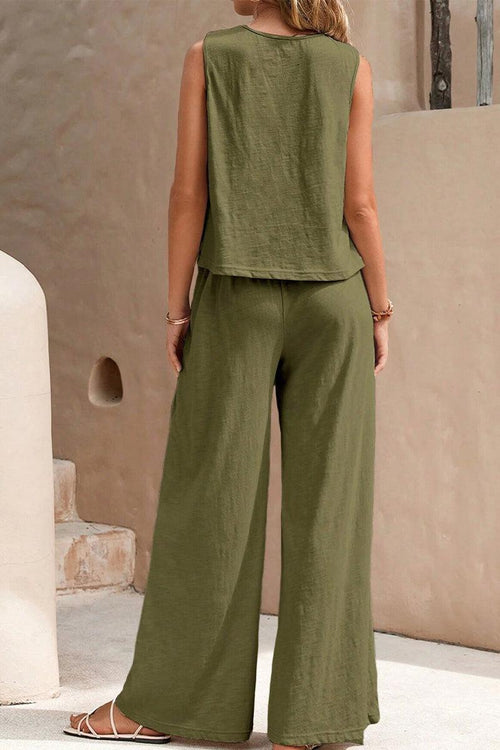 Woman wearing olive green sleeveless wide leg pants set with soft, wrinkle-resistant fabric, perfect for travel and casual occasions