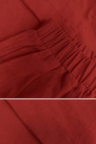 Closup of red 100 cotton two-piece set fabric with elastic waistband and soft breathable texture