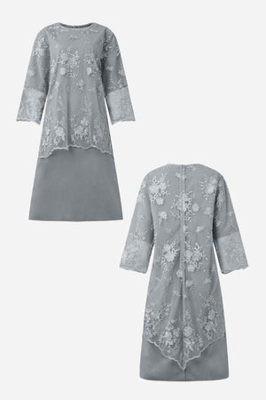 Grey two-piece evening dress with elegant lace details and floral embroidery, featuring a high-low hem and flowing fabric.