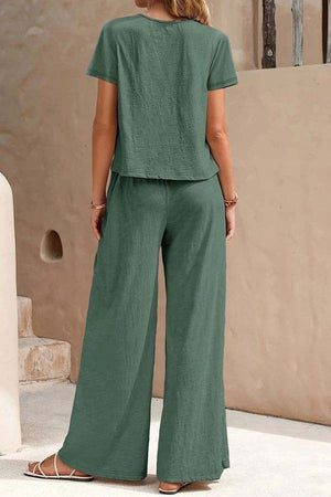 woman wearing green Riviera Relaxed Two Piece Set with short sleeves and wide-leg pants standing outdoors