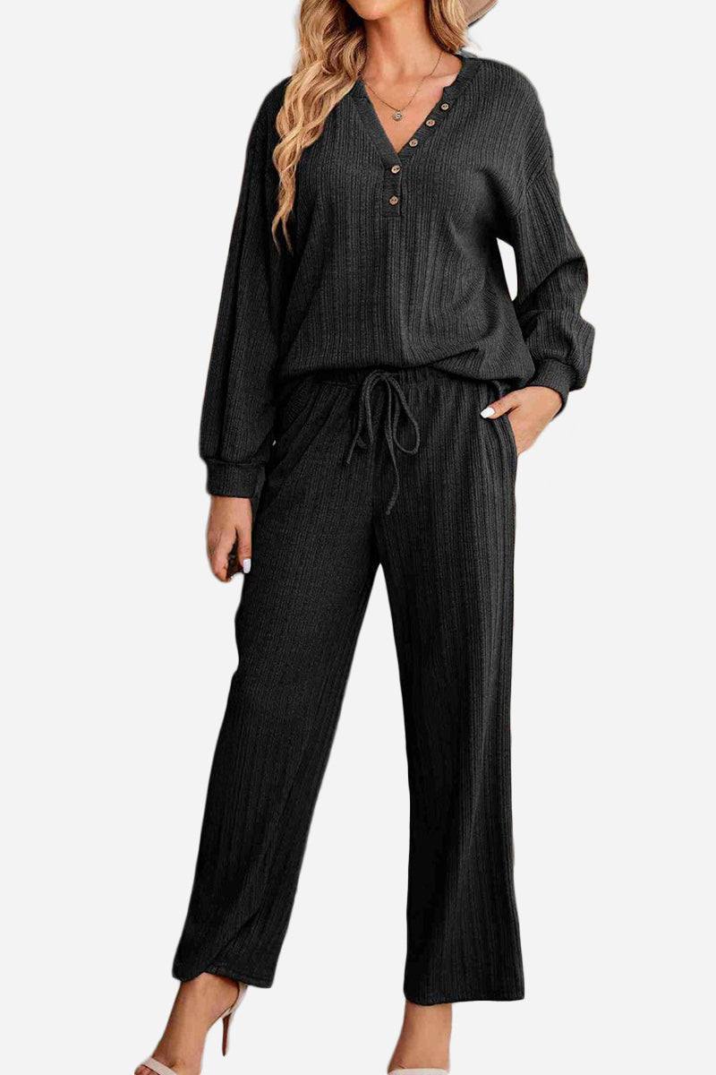 Woman wearing black Desert Bloom Ribbed Comfort Set with V-neck ribbed top and wide-leg pants