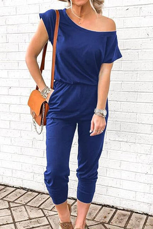 Moonlit Rome Off-Shoulder navy blue jumpsuit with oblique shoulder design and tapered legs