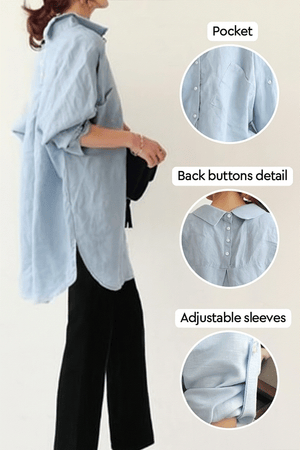 Woman wearing light blue linen-cotton blend Linen Breeze Set with back button details, adjustable sleeves, and black pants.