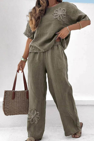 Olive green breathable two-piece set with floral embroidery, loose fit top and wide-leg pants.