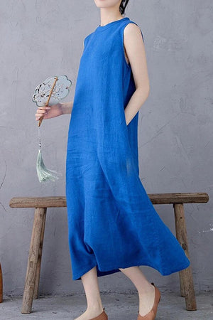 Sleeveless blue linen midi dress with relaxed A-line fit and pockets by Sunrise Market.