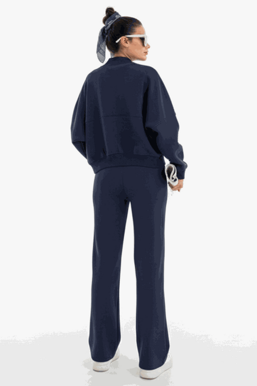 The Voyager Zip Set navy zip-front sweatshirt and wide-leg joggers travel outfit back view