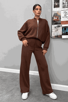 The Voyager Zip Set brown zip-front sweatshirt and wide-leg joggers travel outfit