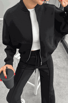 The Voyager Zip Set black zip-front sweatshirt and wide-leg joggers lounge wear with pockets for travel and casual style