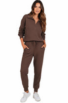 Unisex half-zip pullover and sweatpants set in brown polyester blend, comfortable and casual activewear for men and women