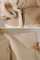 Cropped faux leather sherpa jacket with cream sherpa lining and trim, soft matte finish, and front zipper closure.