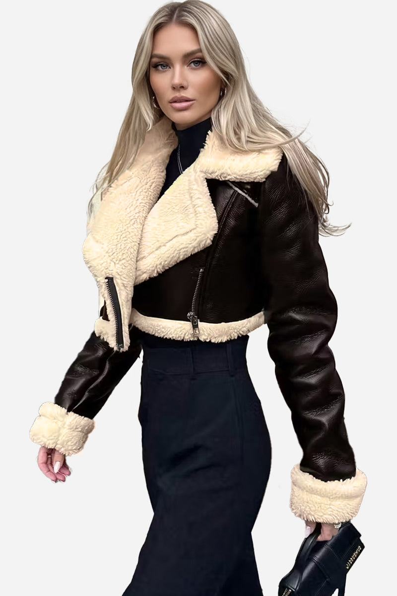 Cropped faux leather sherpa jacket with cream fleece lining and trim, styled on a model.