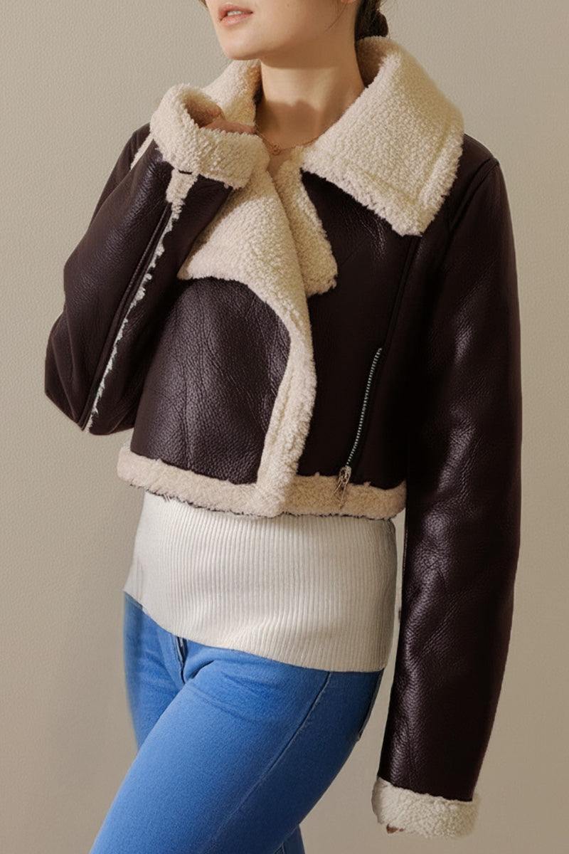 Cropped faux leather jacket with cream sherpa lining and trim, mid-weight warmth, and zipper front closure.