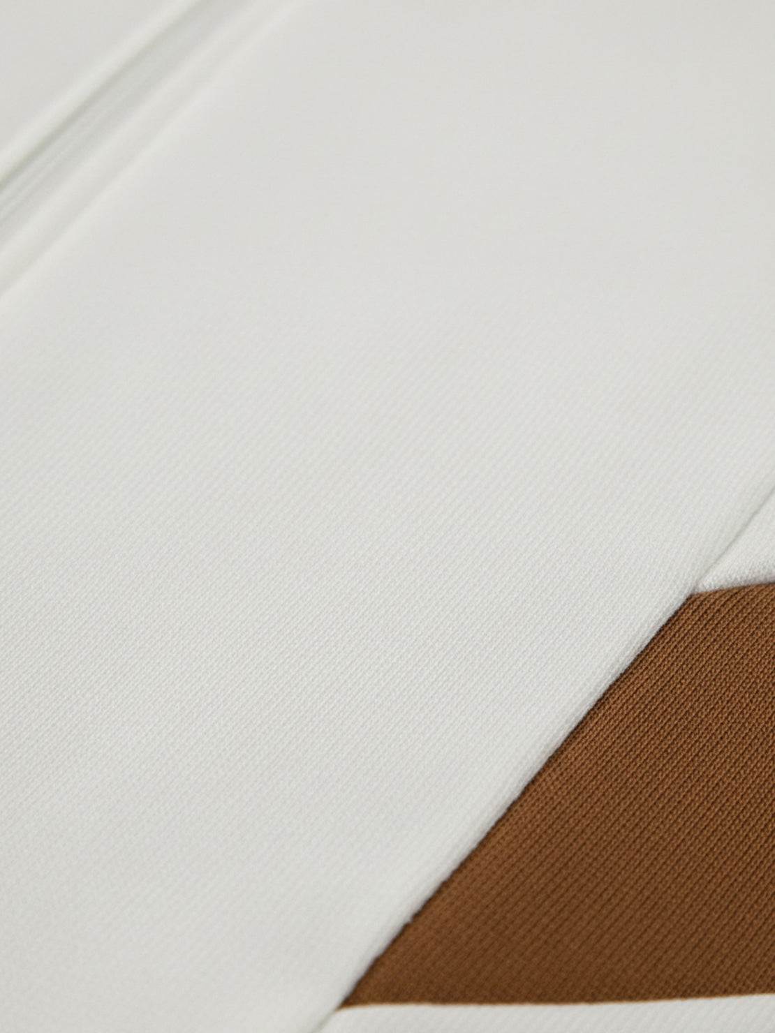 Colorblock Comfort Tracksuit with contrast curved panels and stand collar jacket in wrinkle-resistant polyester fabric