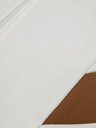 Colorblock Comfort Tracksuit with contrast curved panels and stand collar jacket in wrinkle-resistant polyester fabric