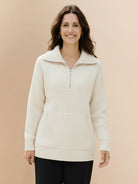 Neutral-toned half-zip waffle pullover with kangaroo pocket and fold-over collar for casual comfort