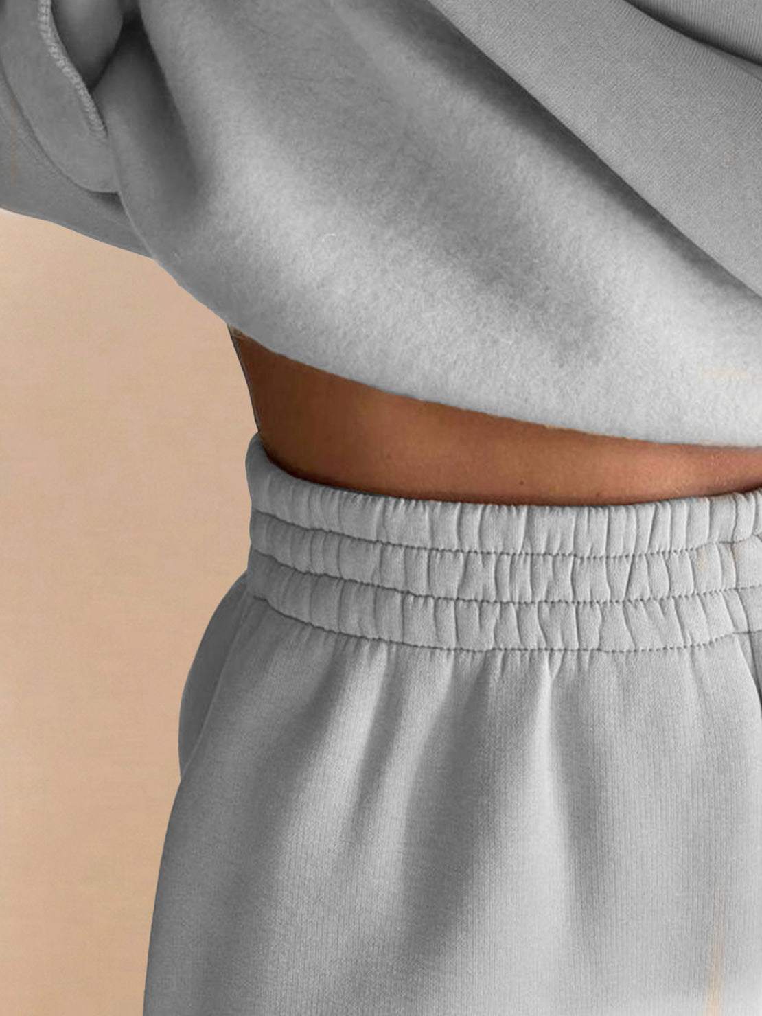 Close-up of grey Warm & Easy Two-Piece Set with elastic waistband and soft sweatshirt fabric.