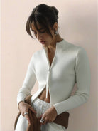 Women's zip-up knit cardigan jacket with vertical ribbing and high neckline