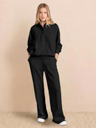 Wrinkle-free polo set with structured quarter-button top and high-waisted pants in breathable fabric