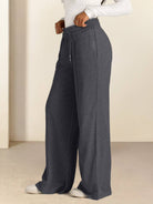 Soft knit wide-leg pants with relaxed fit and elastic drawstring waist in breathable fabric