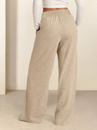 Soft knit wide-leg pants with elastic drawstring waist and side pockets in breathable fabric