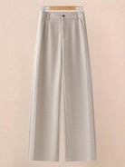 Beige thermal wool blend trousers with wide-leg cut and elastic back waist hanging on wooden hanger