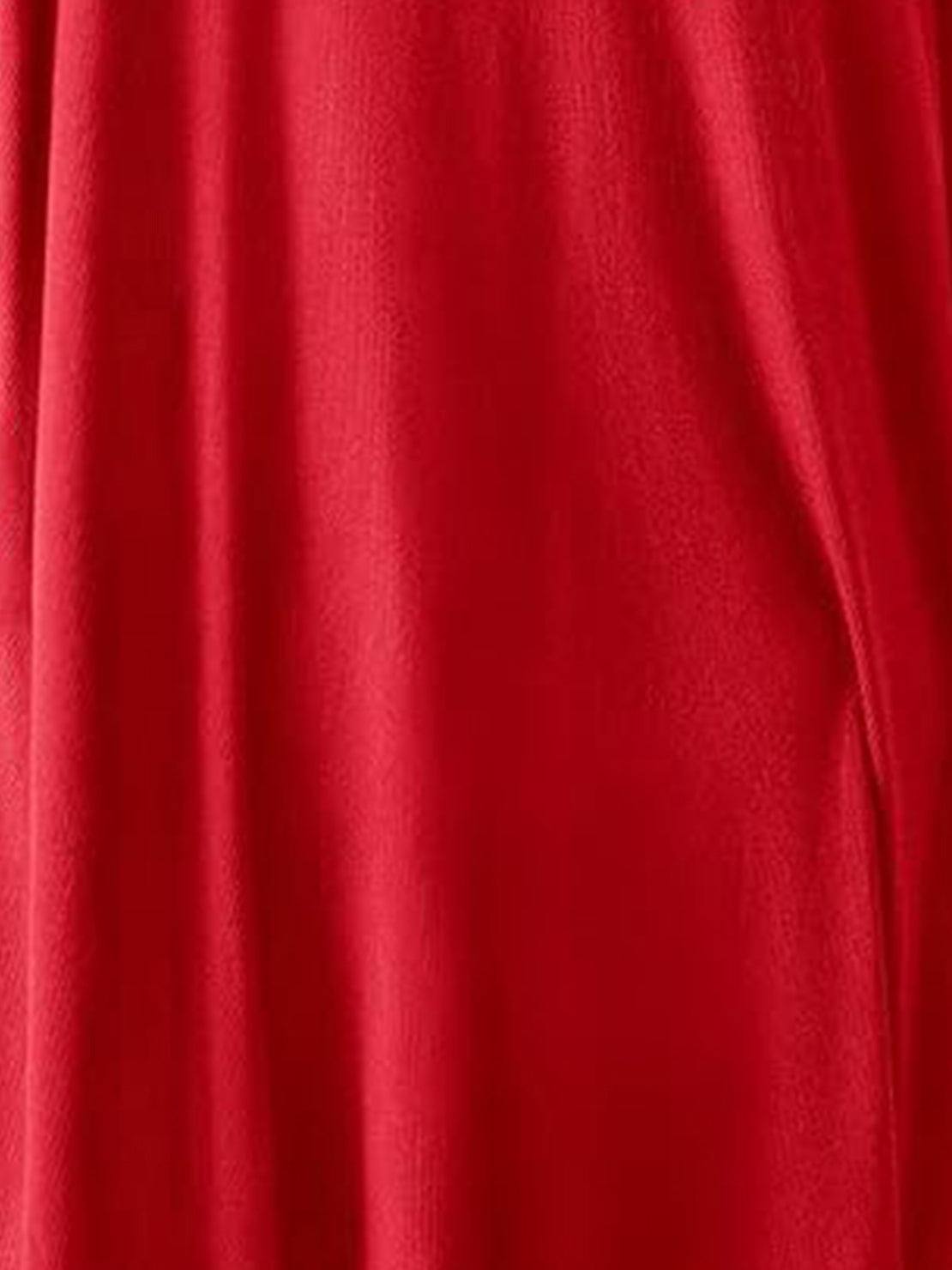 Woman wearing oversized long-line pullover and wide-leg pants loungewear set