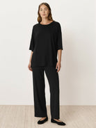 Oversized long-line loungewear set with short-sleeve pullover and wide-leg pants in soft knit fabric