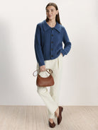 Wool-blend button-front cardigan with wide collar and five-button closure for lightweight warmth and layering