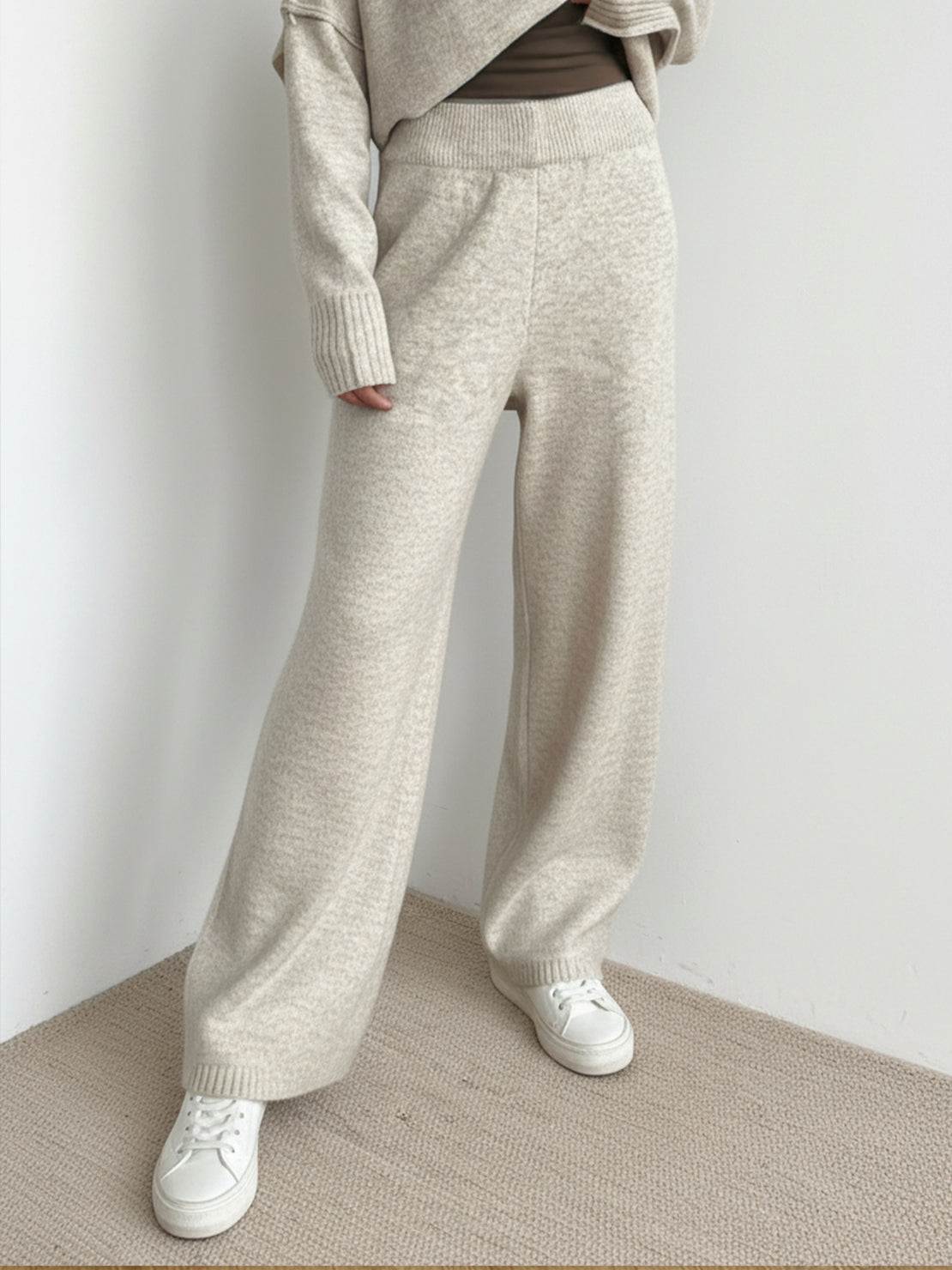 woman wearing soft-knit turtleneck two-piece set with wide-leg pants and mock turtleneck