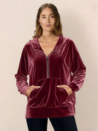 Ultra-soft velvet half-zip hoodie with kangaroo pocket and relaxed fit
