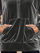 Ultra-soft velvet half-zip hoodie with plush texture and kangaroo pocket