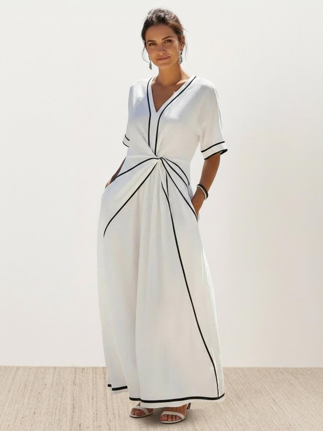 Knot-waist maxi dress with V-neckline, batwing sleeves, and flowing skirt in lightweight fabric